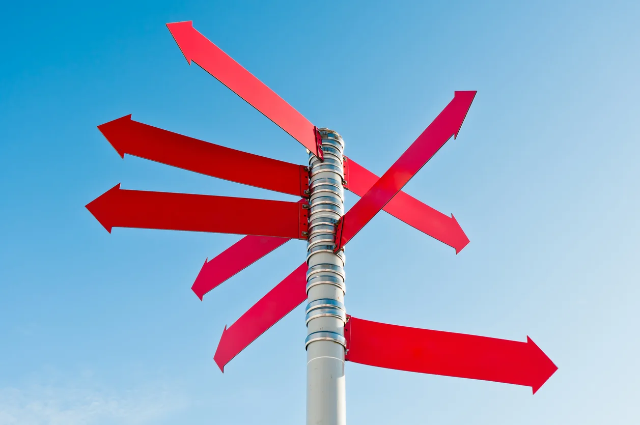 Multi-directional red sign stock photo