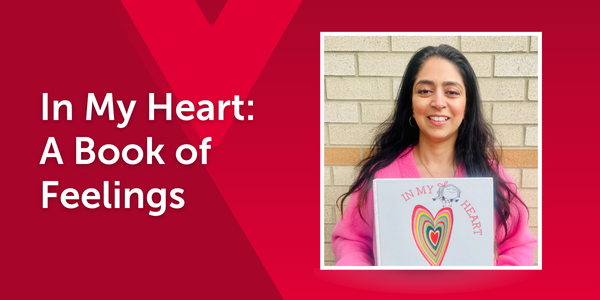 An educator holds In My Heart: A Book of Feelings by Jo Witek, showing its bright heart-shaped cover. The image is overlaid on a red background with a faint Y M C A logo and text that reads the book title.