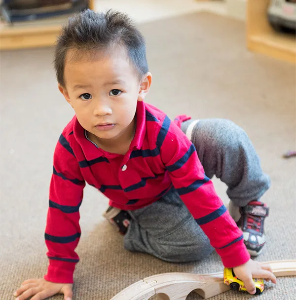 boy playing with train