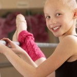 child-ballerina-stretching-her-leg