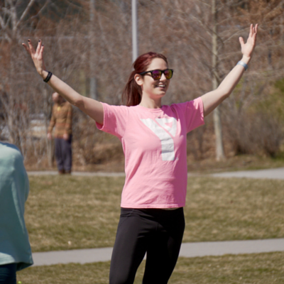 Caileigh teaching yoga in a park