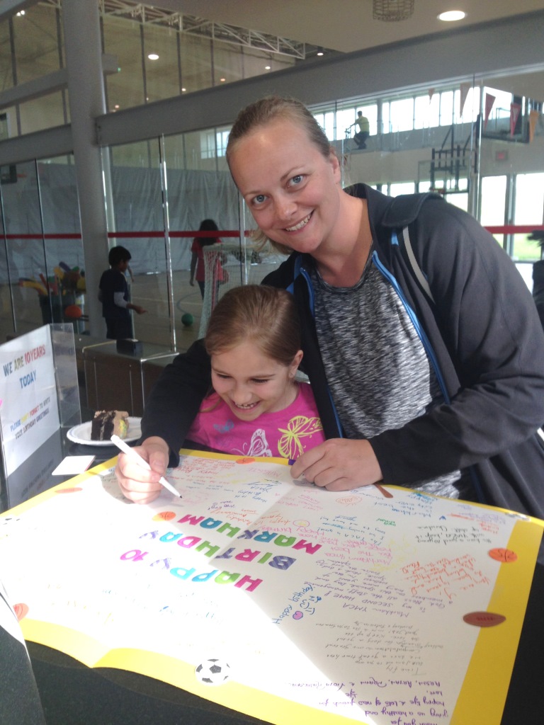 Members sign Markham YMCA's birthday card