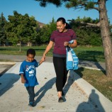 Mother walking child to school