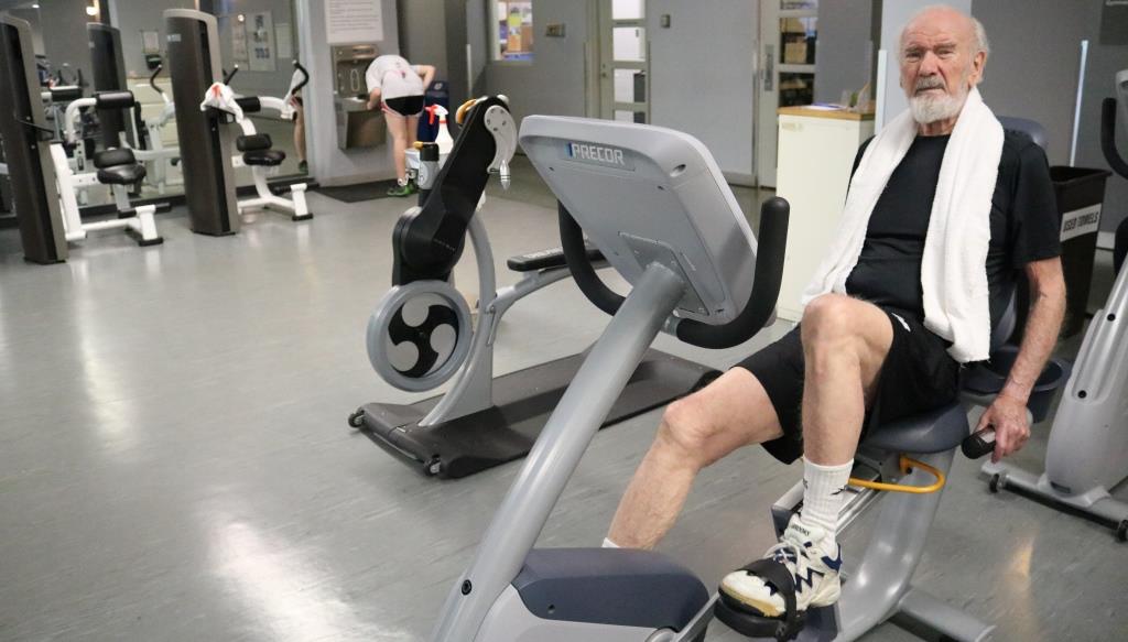 Norm Kirk on a stationary bike in the Central YMCA conditioning room