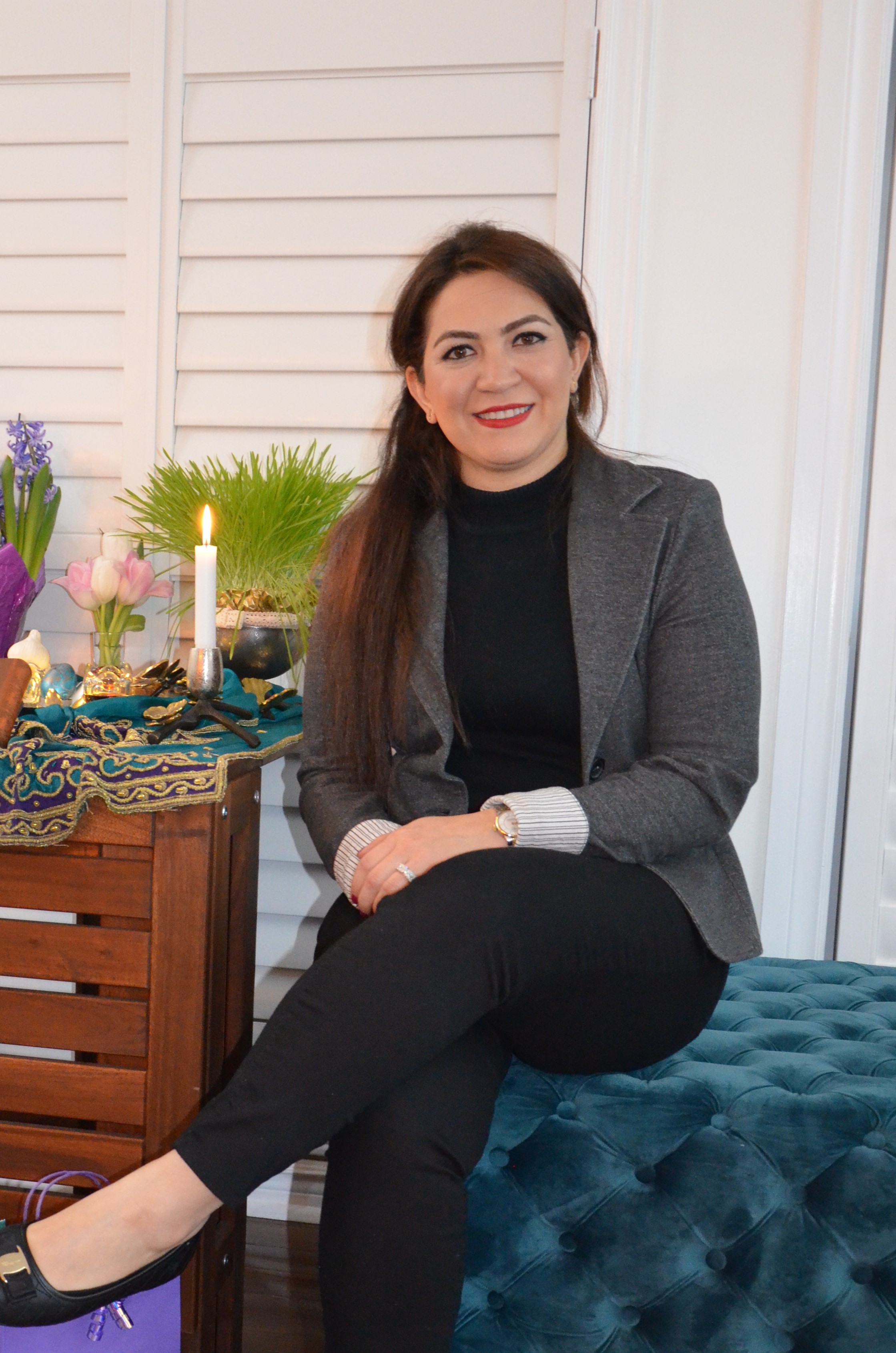 Nazanin sitting in a chair