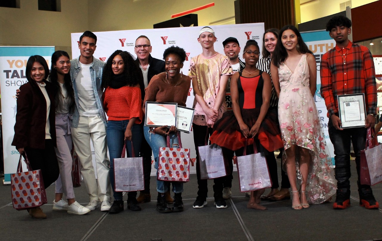 Contestants smiling on stage