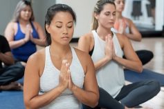 Group of people sitting and meditating