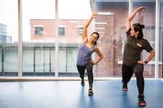 Two women stretching in a lunge