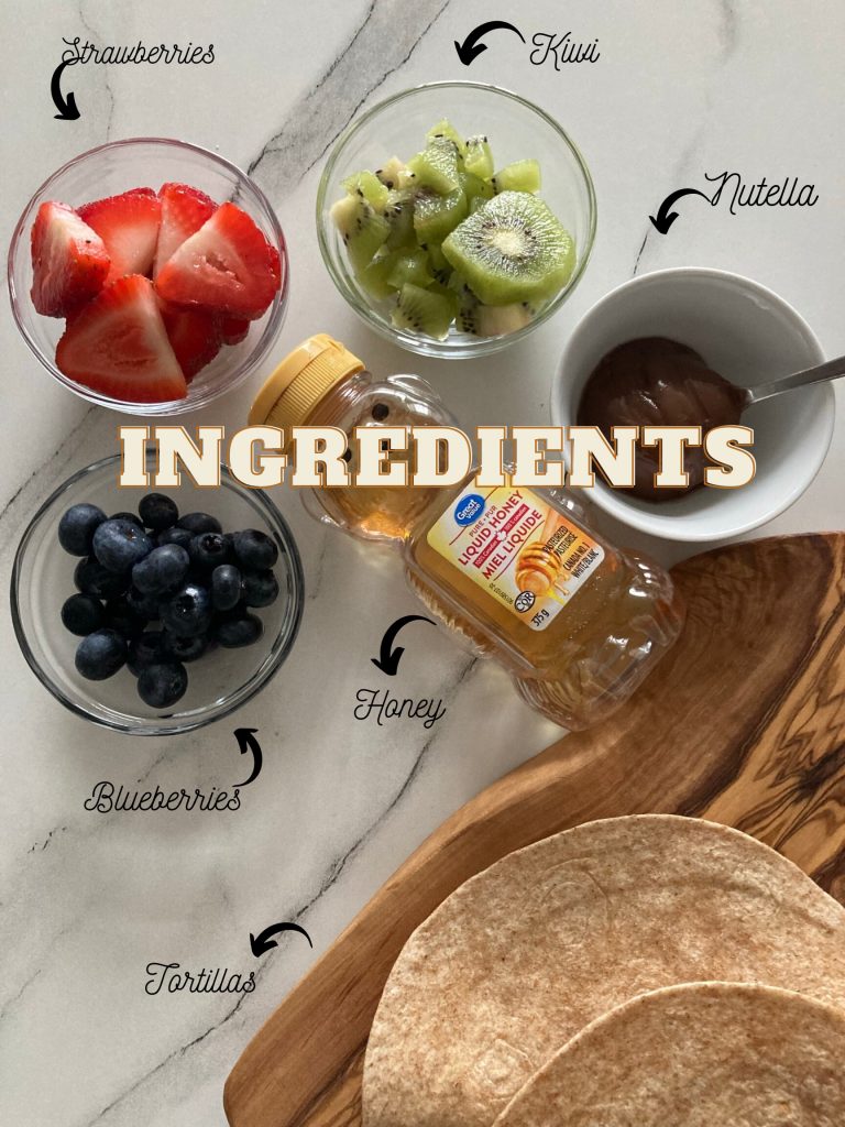 A flatlay shot of blueberries, strawberries, kiwi, nutella, honey and tortillas kept on a table.