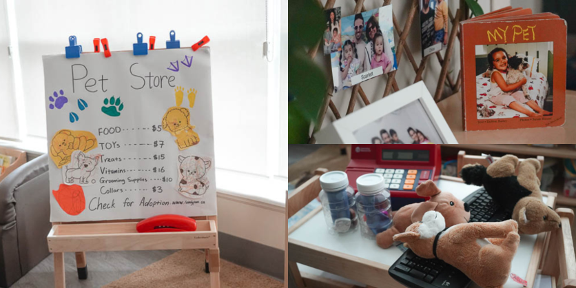 A pet store programming setup at Toronto Pinnacle YMCA Child Care centre that includes a pet store price list on a wooden easel, dog plush toys on a table next to a toy cash register and a small red book with a child holding a dog on the cover.